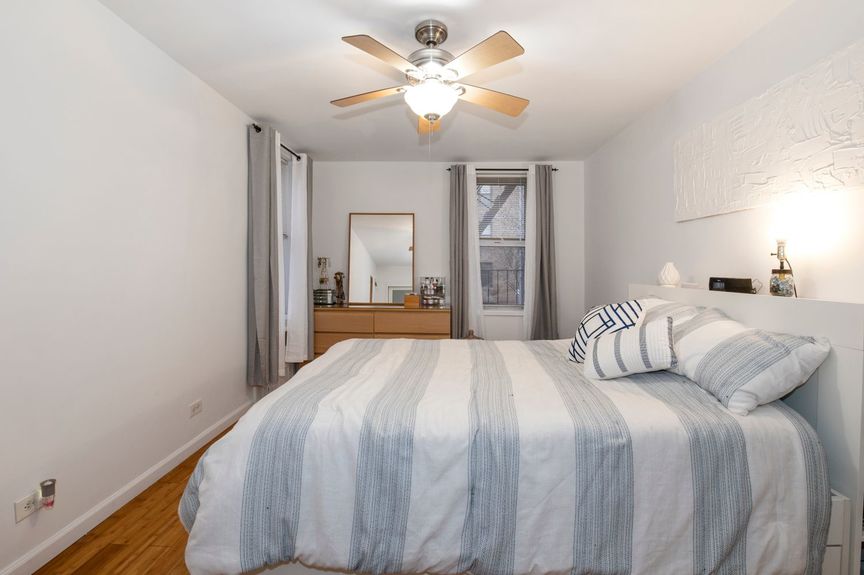 Bedroom with fandeliers