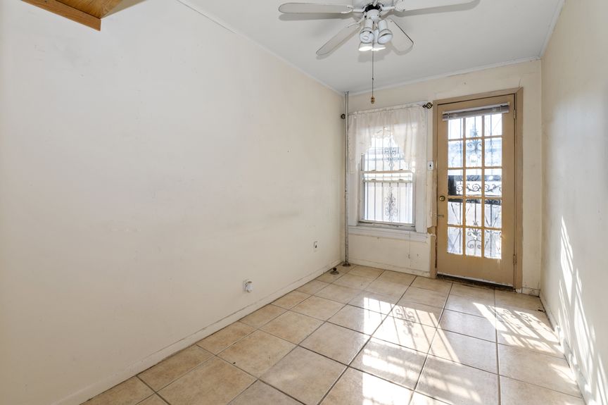 second bedroom on the first floor with access to the back yard