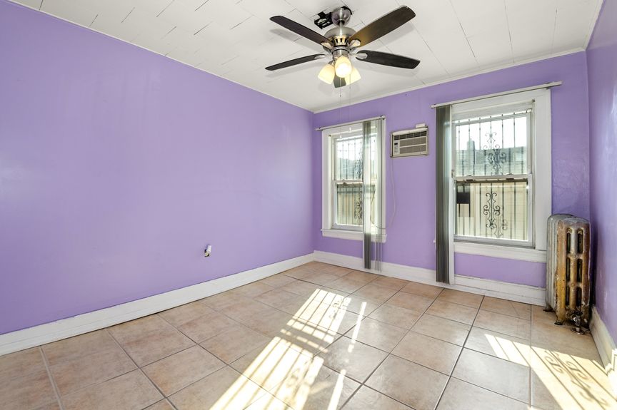 Bedroom on the first floor with lavender paint color