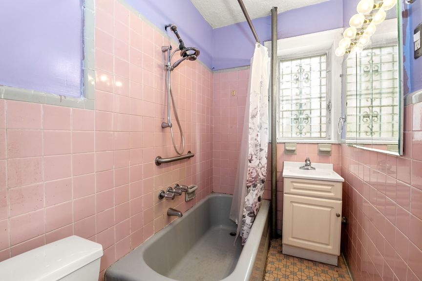 Bathroom on the first floor with pink tile