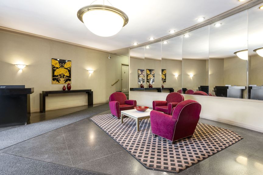 Lobby with three purple chairs