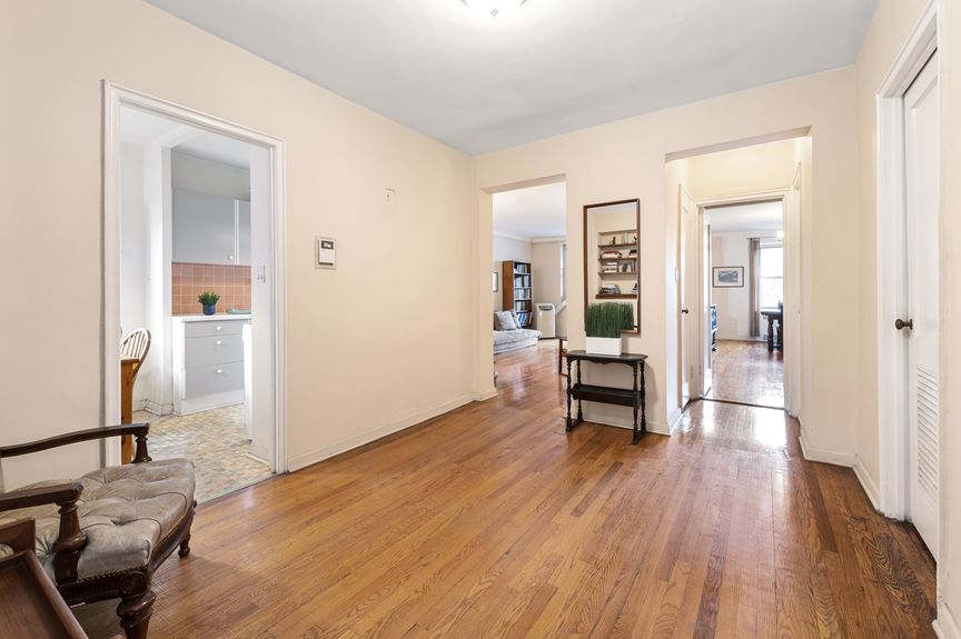 Sitting room with a view of the kitchen, living room, and bedroom
