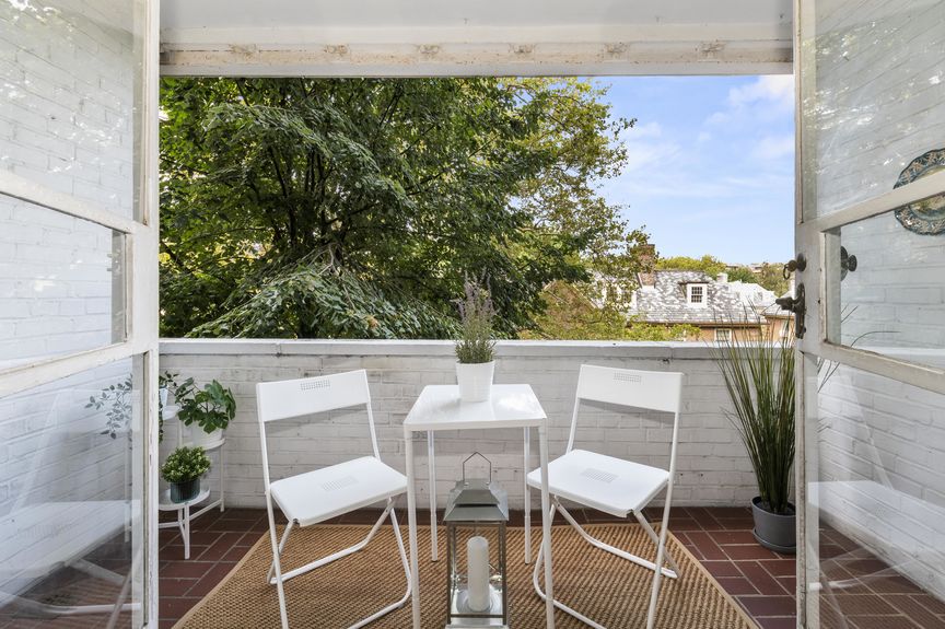 Balcony with a table and two chairs