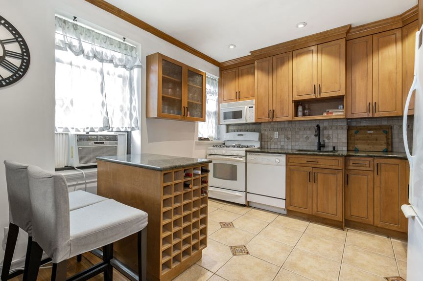 Kitchen with a stove, microwave, and dishwasher