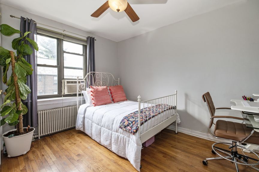 Bedroom with one window and a bed
