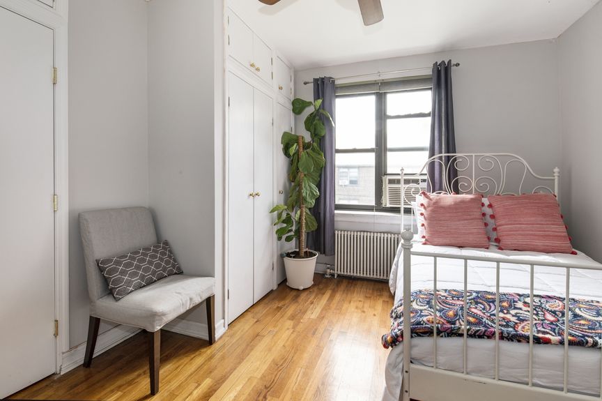 Bedroom with one window, a bed, and closet