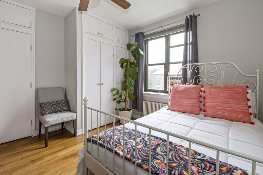 Bedroom with one window, a bed, and closet