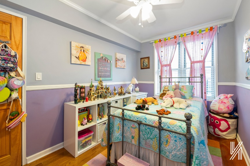 Second bedroom with a one-size-full bed and a large window