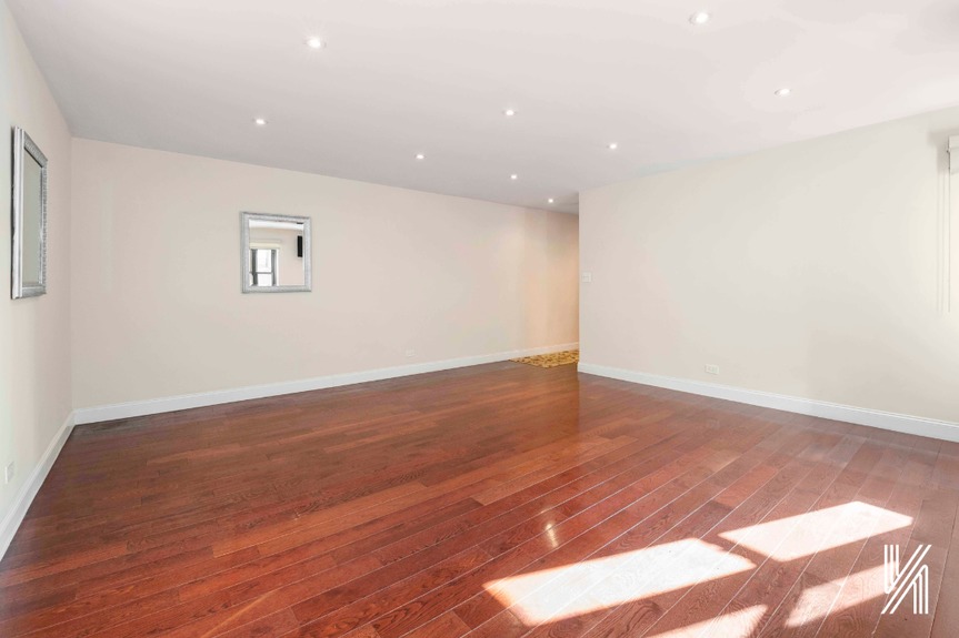 Empty living room showing the two cute mirrors