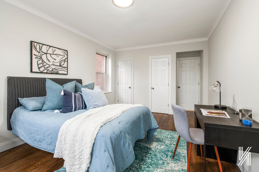 Bedroom with window and 3 doors