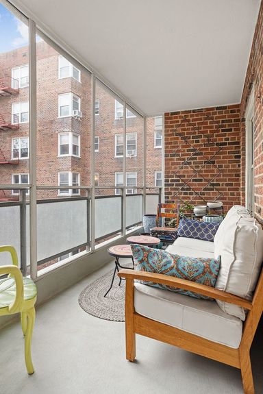 Beautiful private outdoor space with tables and couch