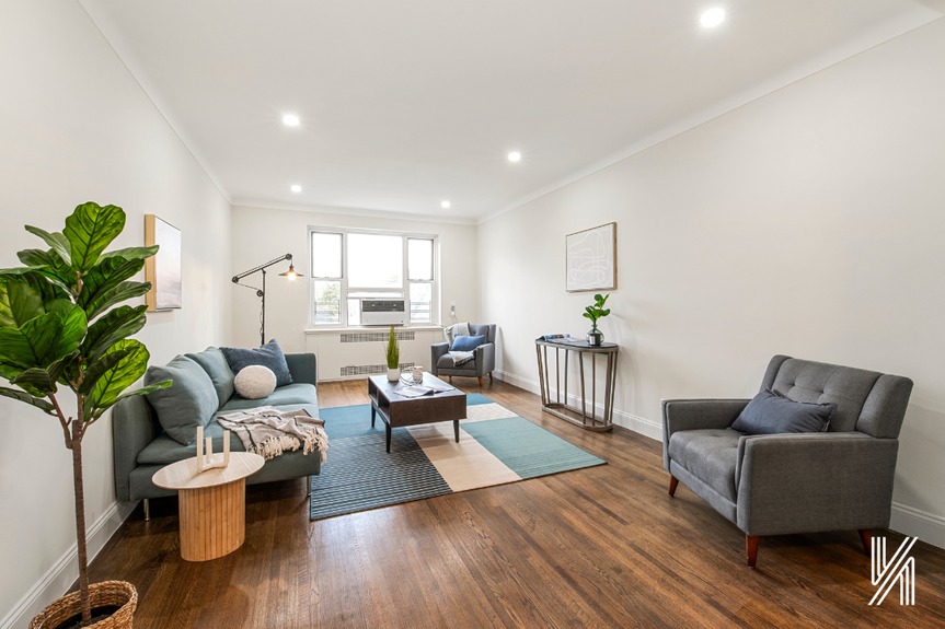 Main Living room with couch, single sofa, coffee table and window