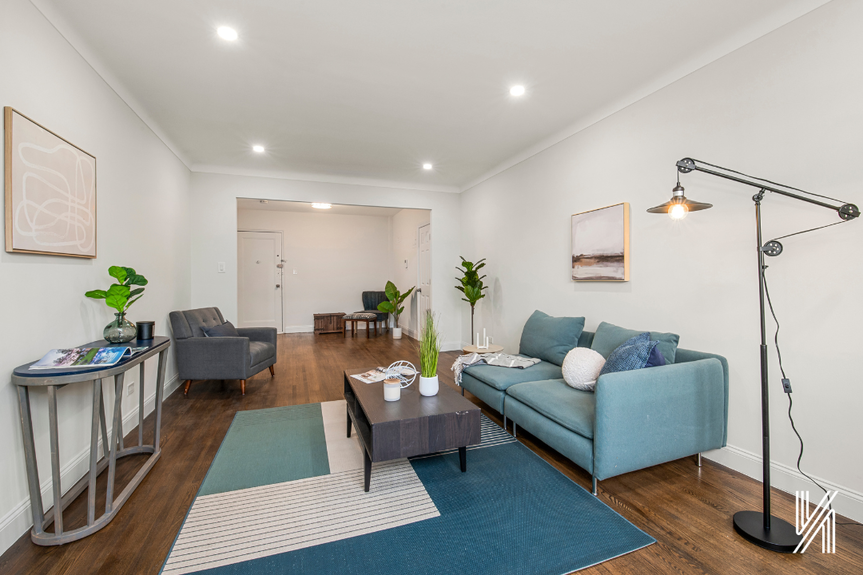 Large open Living room with couch, single sofa, and coffee table
