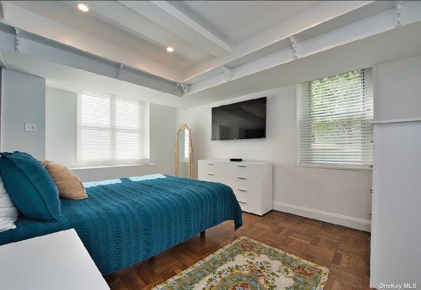 Bedroom with bed and dresser