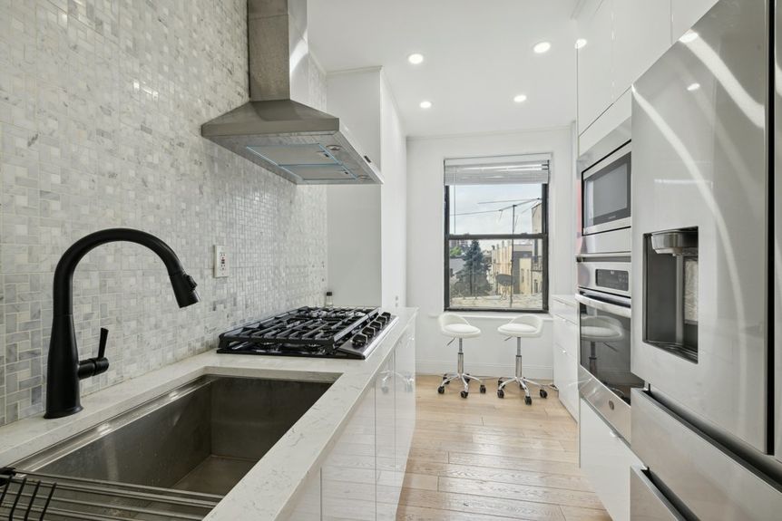 Aesthetic white kitchen with one window