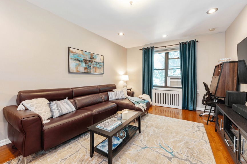 living room photo of 22-31 77th St, A2