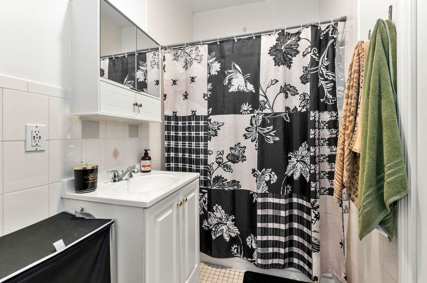 Bathroom at 18-42 Norman St, a two-family house in Ridgewood, Queens (11385).