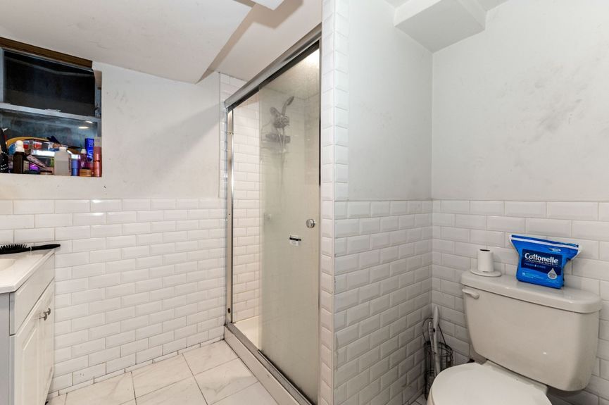 Bathroom at 18-42 Norman St, a two-family house in Ridgewood, Queens (11385).