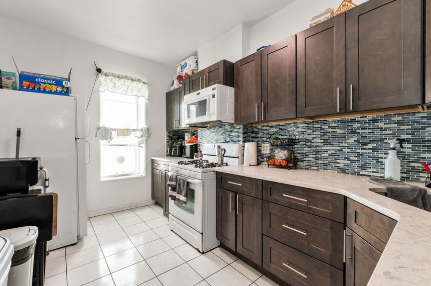 Kitchen at 18-42 Norman St, a two-family house in Ridgewood, Queens (11385).