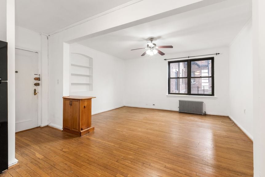 Living room at 22-43 77th St, unit C1, a condo apartment in Astoria, Queens (11370).