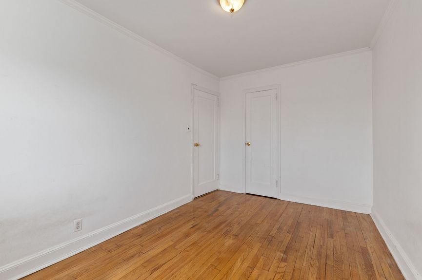 Second bedroom at 20-29 28th St, a single-family home in Astoria, Queens (11105).