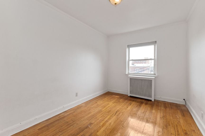 Second bedroom at 20-29 28th St, a single-family home in Astoria, Queens (11105).