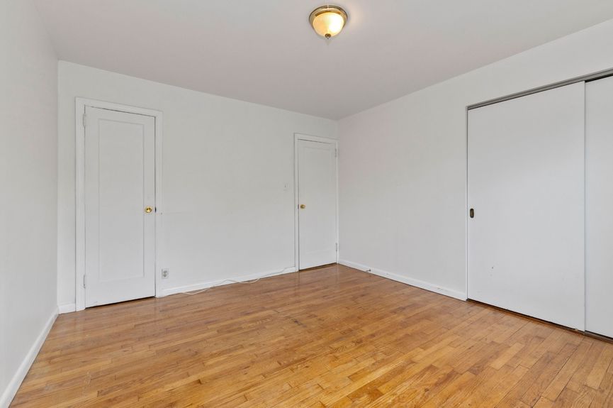 Primary bedroom at 20-29 28th St, a single-family home in Astoria, Queens (11105).
