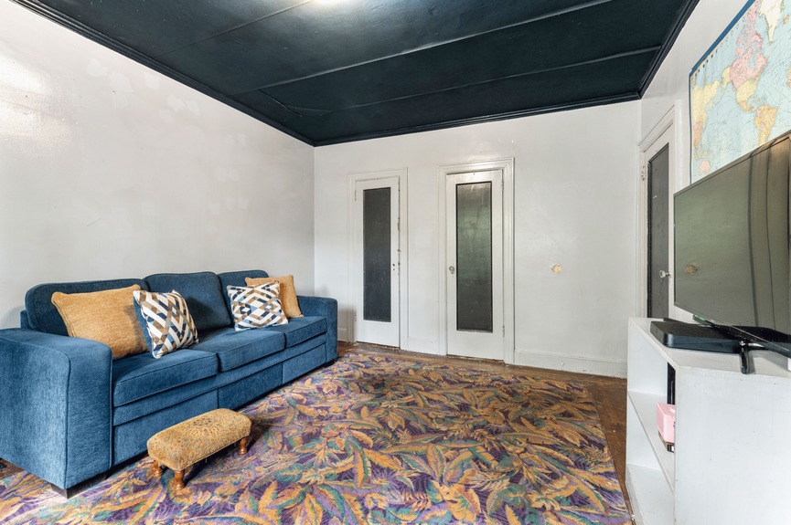 Bedroom at 34-32 84th St, a single-family house in Jackson Heights, Queens (11372).