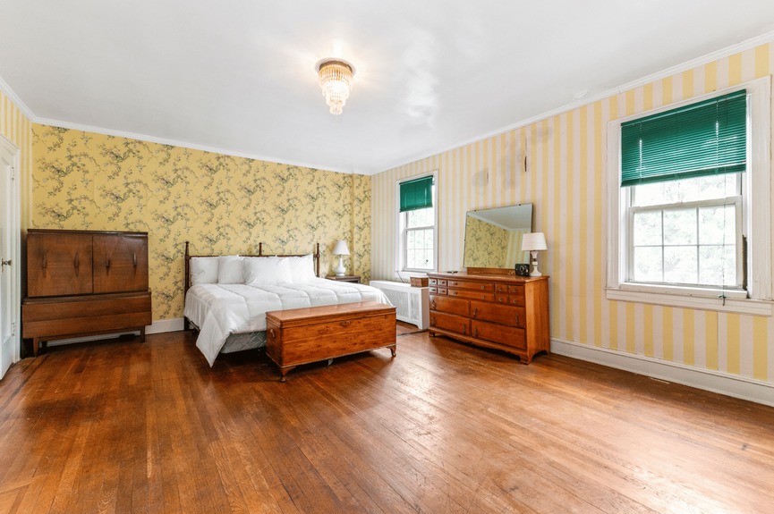 Bedroom at 34-32 84th St, a single-family house in Jackson Heights, Queens (11372).