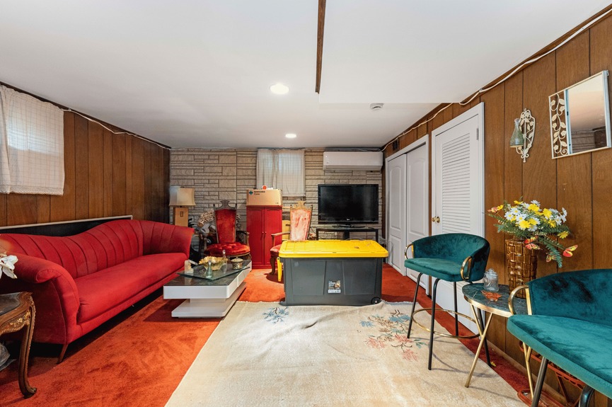 Entertainment room at 130-32 144th St, a single-family house in Jamaica, Queens (11436).