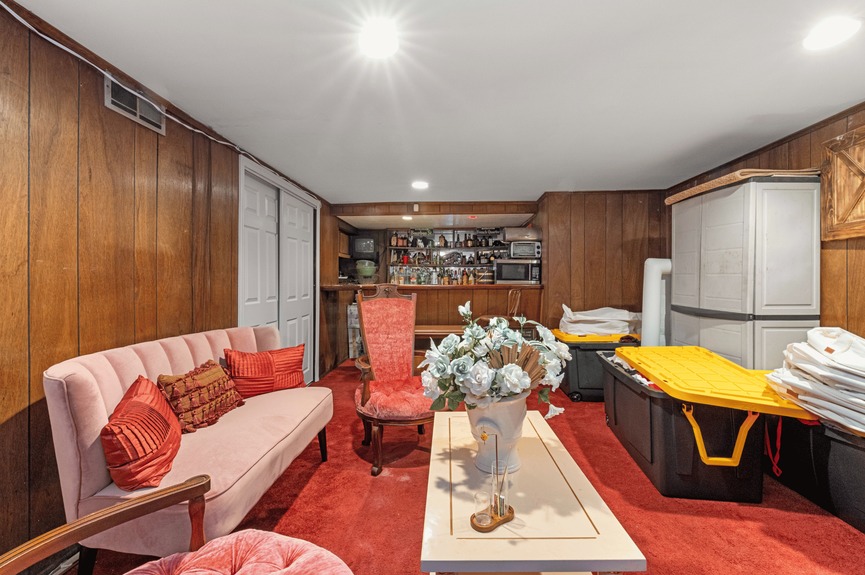 Entertainment room at 130-32 144th St, a single-family house in Jamaica, Queens (11436).
