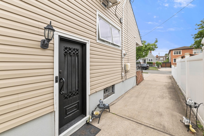 Exterior at 130-32 144th St, a single-family house in Jamaica, Queens (11436).