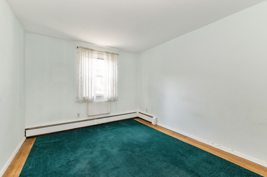 Bedroom at 144-24 25th Drive, a multi-family home in Flushing, Queens (11354)