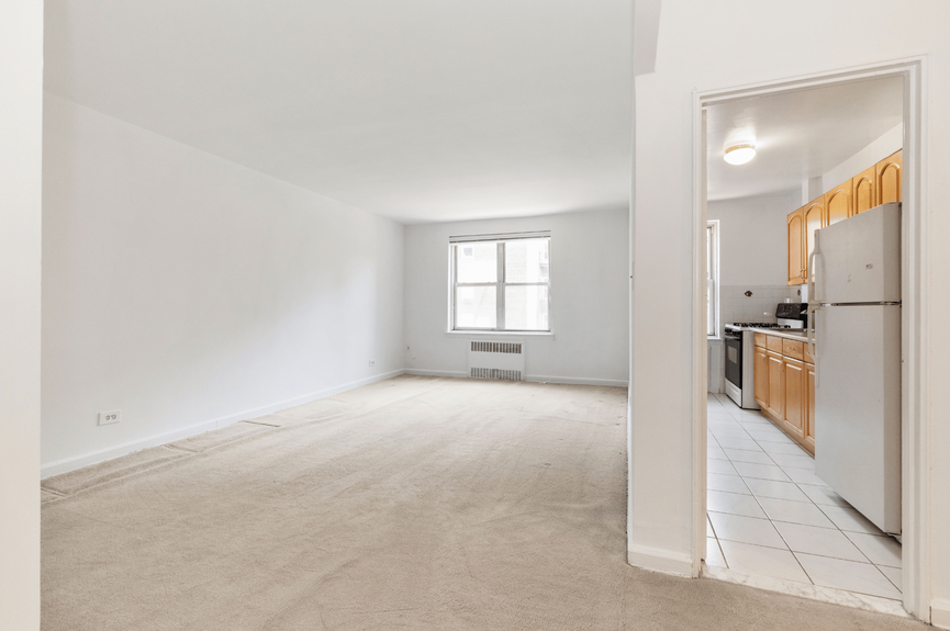 Living room and Kitchen at 39-65 51st St, Unit 4B, a co-op apartment in Woodside, Queens (11377)
