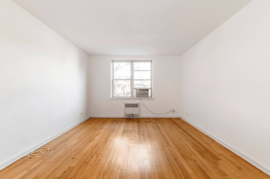 Living room and Dining Area at 39-25 51st St, Unit 1F, a co-op apartment in Woodside, Queens (11377)