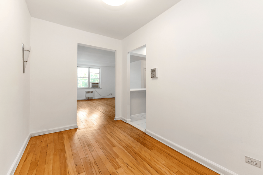 Living room, Dining Area, and Foyer at 39-25 51st St, Unit 1F, a co-op apartment in Woodside, Queens (11377)