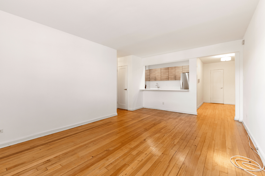 Living room, Dining Area, Foyer, and Kitchen at 39-25 51st St, Unit 1F, a co-op apartment in Woodside, Queens (11377)