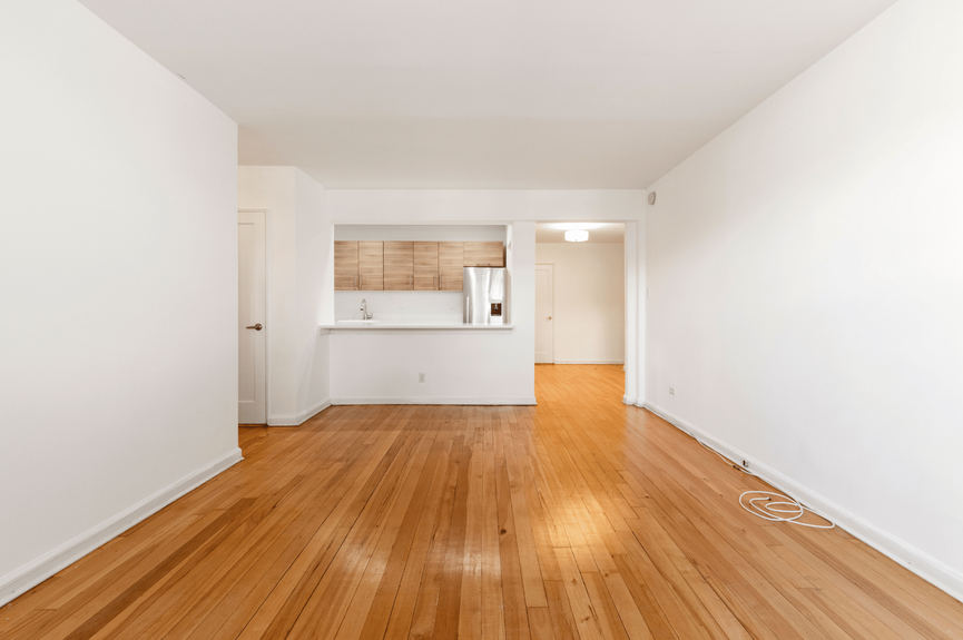 Living room, Dining Area, Foyer, and Kitchen at 39-25 51st St, Unit 1F, a co-op apartment in Woodside, Queens (11377)