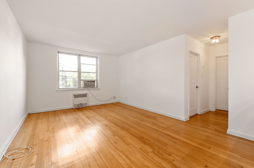 Living room, Dining Area, and Hall at 39-25 51st St, Unit 1F, a co-op apartment in Woodside, Queens (11377)