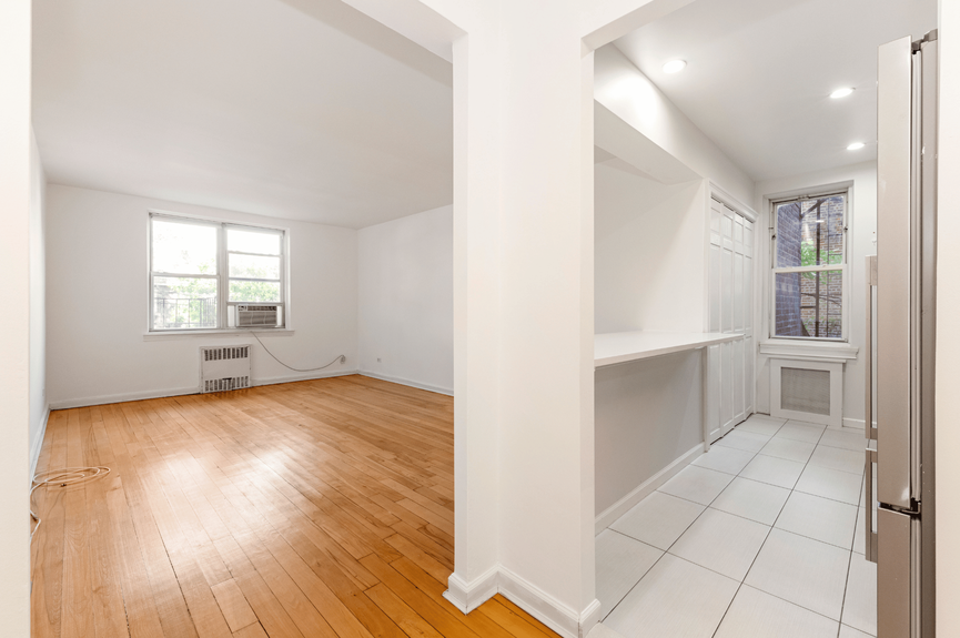 Living room, Dining Area, and Kitchen at 39-25 51st St, Unit 1F, a co-op apartment in Woodside, Queens (11377)