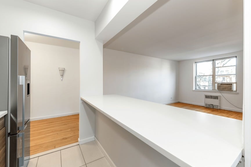Living room, Dining Area, and Kitchen at 39-25 51st St, Unit 1F, a co-op apartment in Woodside, Queens (11377)