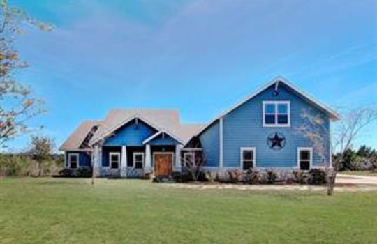 Picture of a blue bricked house in Circle D-KC Estates