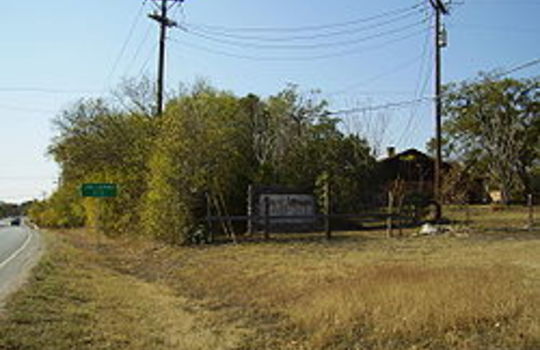 Picture of road leading into San Leanna Texas