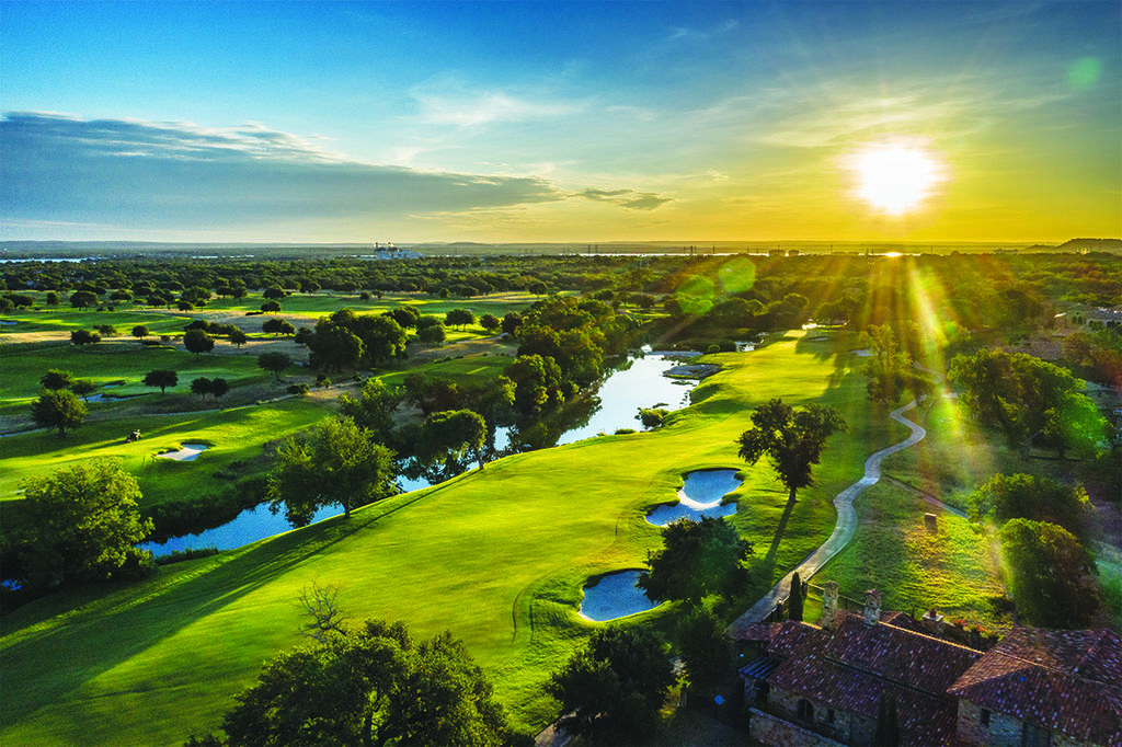 Golden hour at Escondido Golf & Lake Club on Lake LBJ, featuring Tom Fazio–designed golf course and luxury waterfront setting in Horseshoe Bay, Texas.