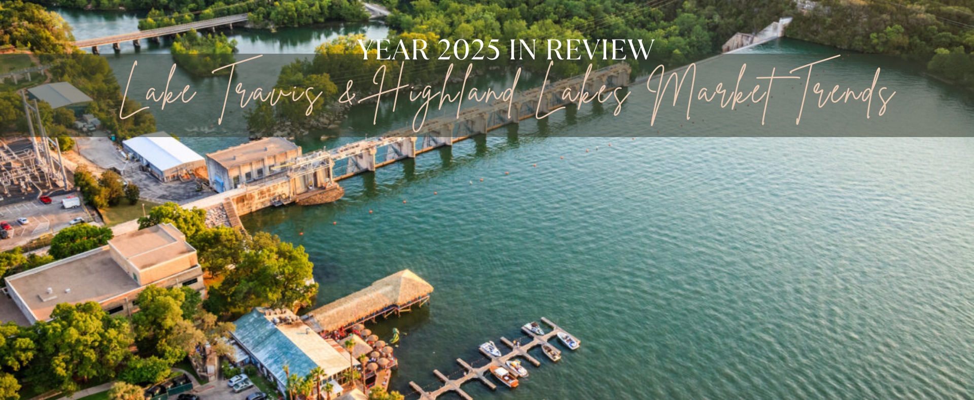 Aerial view of Lake Travis waterfront homes and boat docks at full lake levels in Central Texas