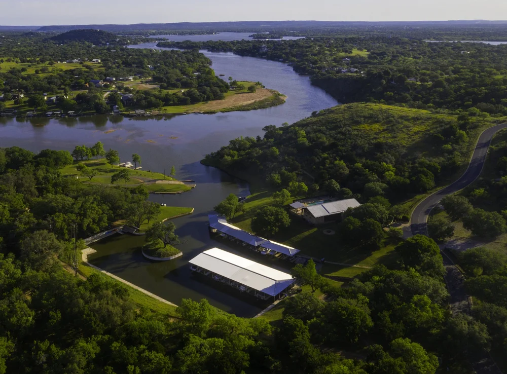 Aerial view of The Trails of Horseshoe Bay on Lake LBJ, featuring private marina access, winding waterways, and Texas Hill Country surroundings.