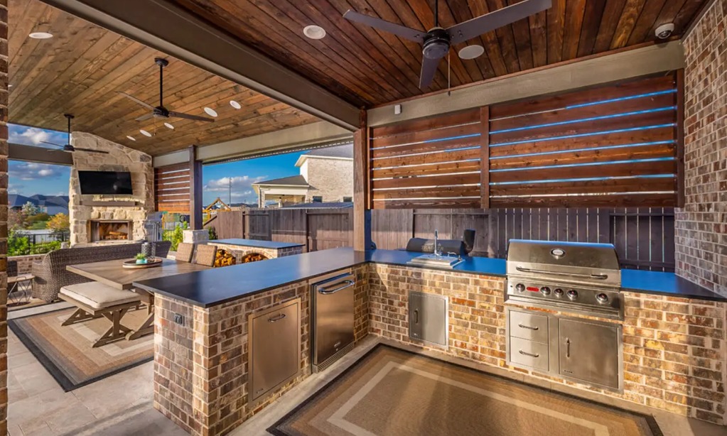 Lakefront home with outdoor kitchen and entertaining space on Lake LBJ or Lake Travis, a desirable feature that enhances lakefront living.