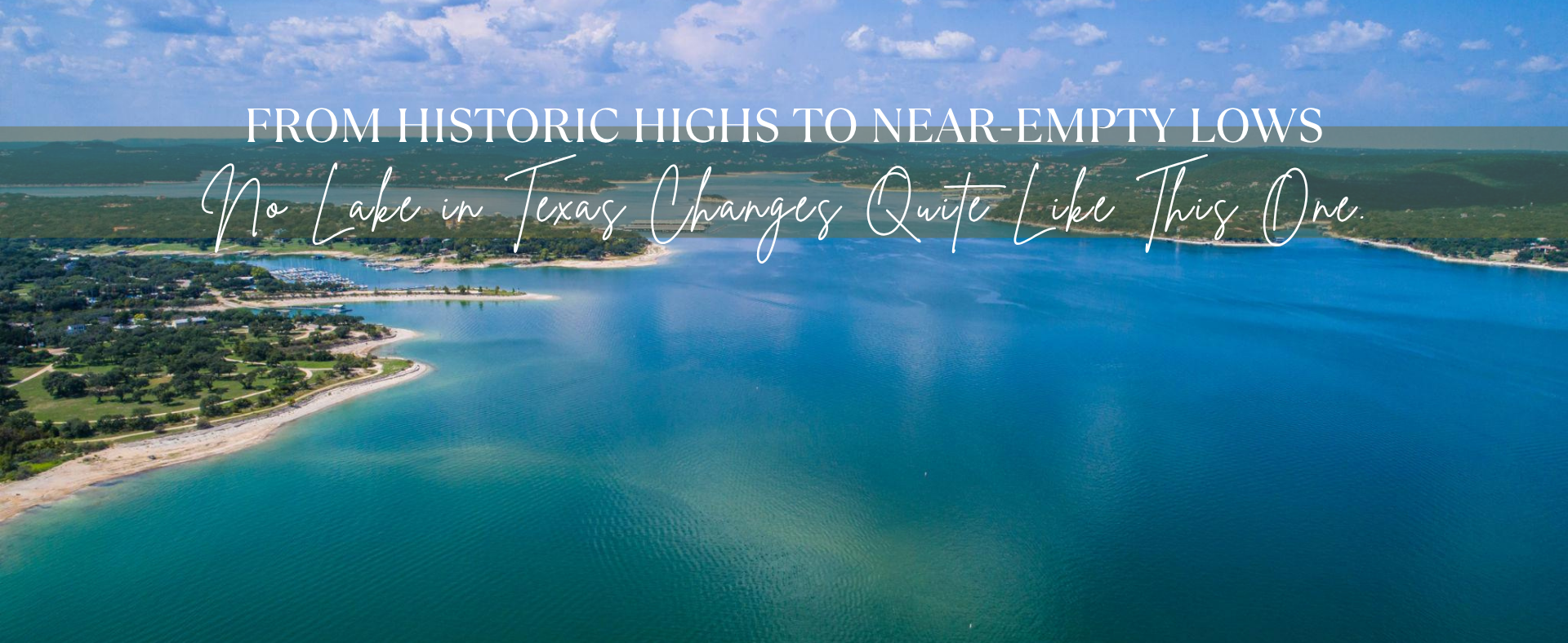 Aerial view of Lake Travis showing dramatic low water levels and exposed shoreline during drought conditions in Central Texas.